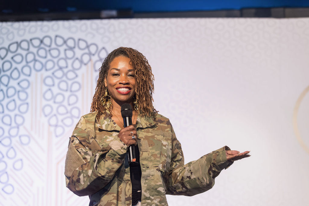 Renea Jones-Hudson speaking on stage